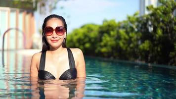 Young Woman Relaxing In A Swimming Pool video