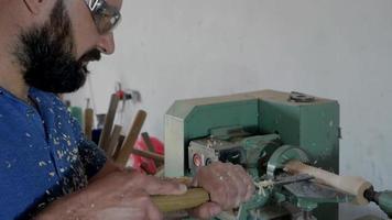 Woodcomer with Protective Glasses Shaping with a Lathe video