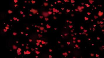 Red Hearts Floating on a Black Screen Background video