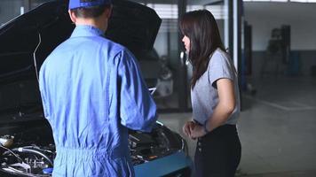 Auto Technician Showing Car Engine to Costumer video