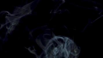 White smoke waves on a dark background video
