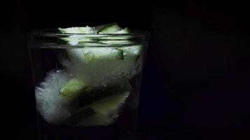 Placing An Ice With Cucumber In Mineral Water video