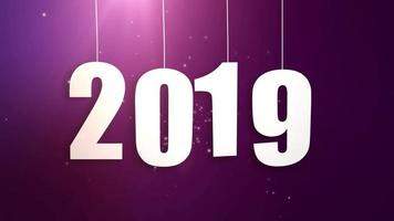 Happy New Year 2019 white paper numbers hanging on strings falling down pink background video