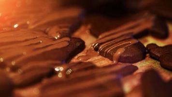 drizzling chocolate onto fresh cocoa christmas cookies