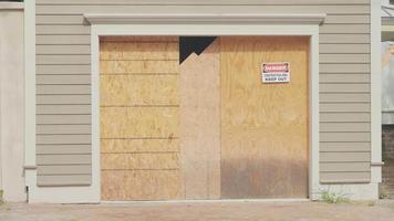 Handheld Clip Of House Facade With Danger Sign video