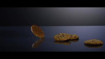 Falling cookies from above onto a reflective surface - COOKIES 194 video