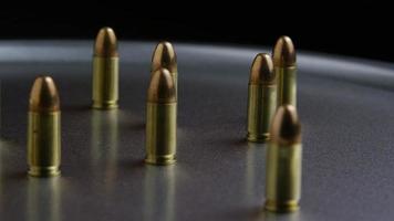 Cinematic rotating shot of bullets on a metallic surface - BULLETS 051 video