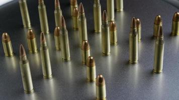 Cinematic rotating shot of bullets on a metallic surface - BULLETS 069 video