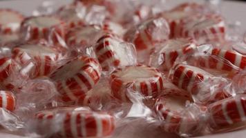 Rotating shot of peppermint candies - CANDY PEPPERMINT 016 video
