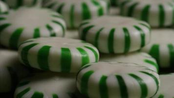 Rotating shot of spearmint hard candies - CANDY SPEARMINT 056 video