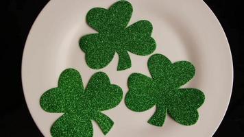 Rotating stock footage shot of St Patty's Day clovers on a white surface - ST PATTYS 002 video