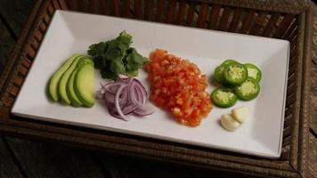 Rotating shot of beautiful, fresh vegetables on a wooden surface - BBQ 112 video