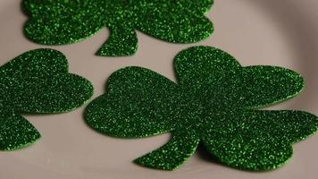 Rotating stock footage shot of St Patty's Day clovers on a white surface - ST PATTYS 008 video