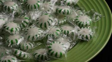 Rotating shot of spearmint hard candies - CANDY SPEARMINT 009 video