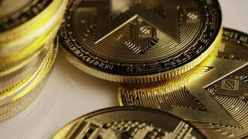 Rotating shot of Bitcoins (digital cryptocurrency) - BITCOIN MONERO 142