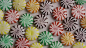 Rotating shot of a colorful mix of various hard candies - CANDY MIXED 007 video