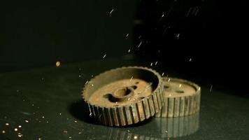 Sparks with gears in ultra slow motion 1,500 fps on a reflective surface - SPARKS w GEARS 002 video