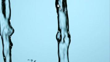Water pouring and splashing in ultra slow motion 1,500 fps on a reflective surface - WATER POURS 163 video