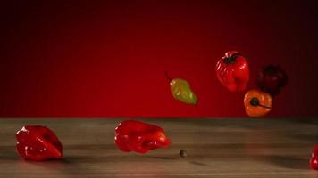 Peppers falling and bouncing in ultra slow motion 1,500 fps on a reflective surface - BOUNCING PEPPERS PHANTOM 002 video