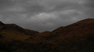 Time Lapse Storm Clouds pass over Shadowed Mountains video