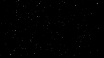 kleine Sterne fallen auf einen schwarzen Hintergrund video