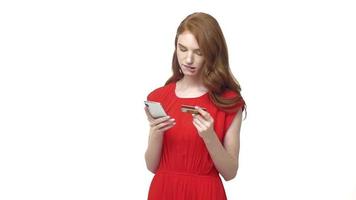 Young Woman Holding Her Credit Card And A Smartphone video