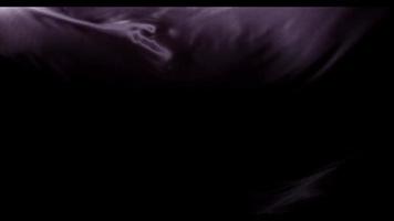 Dark purple fabric moved by the wind with big diagonal waves from lower left and right corner in 4K video