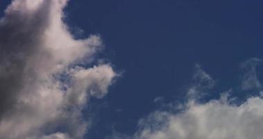 Time lapse of big cumulus clouds crossing slowly the scene from left to right in 4K video