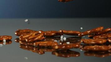 Pretzels falling and bouncing in ultra slow motion 1,500 fps on a reflective surface - PRETZELS PHANTOM 007 video