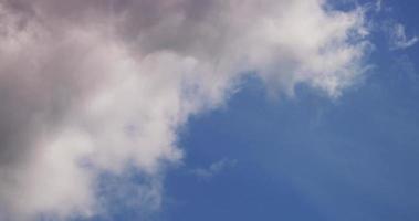 Time lapse of soft dynamic cumulus clouds changing shape from left to right in 4K video