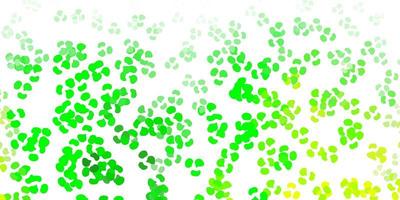Light green, yellow vector backdrop with chaotic shapes.