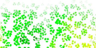 Light green, yellow vector backdrop with chaotic shapes.