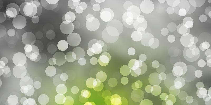 Light Green vector background with bubbles.