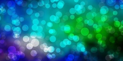 Light Blue, Green vector background with circles.