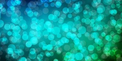 Light Blue, Green vector background with circles.