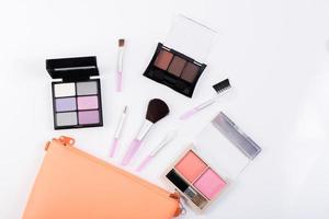 Top view of a make up bag with beauty products photo