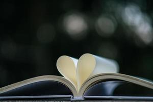 Open book with heart shape photo