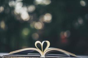 Open book with heart shape photo