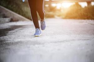 Close-up of running shoes on road photo