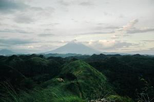 View of a mountain above trees photo