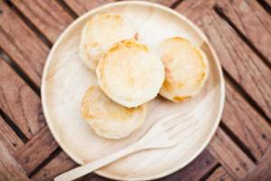 Tarts on a wooden plate photo