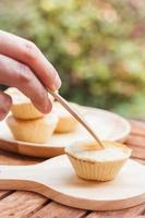 Mini pies on a wooden plate photo