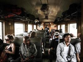 People sitting inside train photo