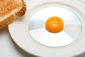 Egg yolk on compact disc photo