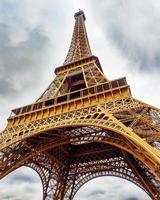 Eiffel Tower under a cloudy sky photo