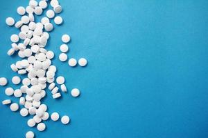 Pills on a blue background photo