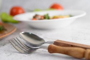 Spoon and fork at table setting photo