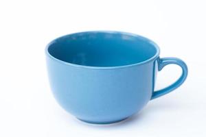 Blue ceramic cup on white background photo