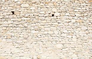 Beige stone wall photo