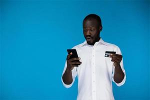 Man with a credit card and a phone photo